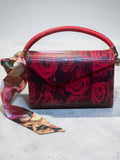 Recrafted Luxe red rose print wood handbag with braided leather handle and brass hardware.